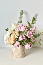 Flower box with a lilac rose