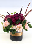 Bordeaux colored flowers in a ceramic container