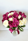 A bouquet of white and bright roses