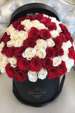 A box of white and red rose flowers