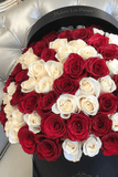 A box of white and red rose flowers