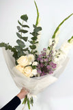 A bouquet of white and bright roses